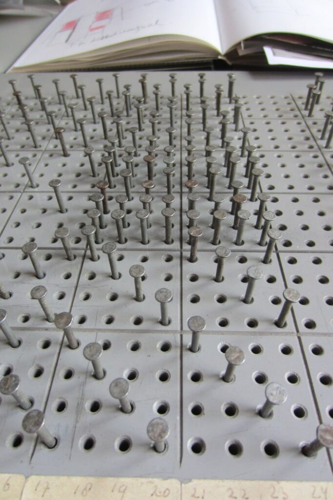 pins in a certain pattern for weaving
